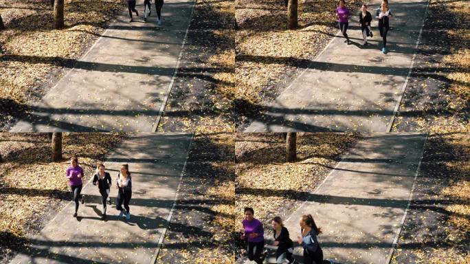 Happy girls jogging in morning sunshine in public 