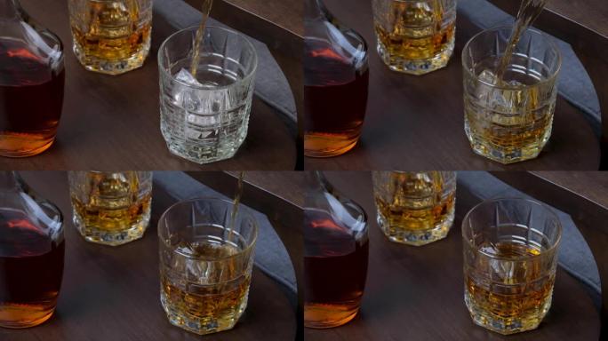 倒入玻璃中的金色威士忌或波旁威士忌。干邑白兰地或朗姆酒在慢动作中流动