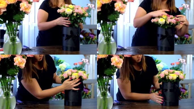 花店妇女制作一束玫瑰花，将其放在商店的包装盒中。
