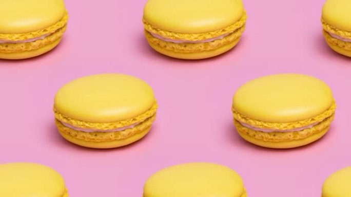 粉红色背景上的黄色马卡龙饼干图案。