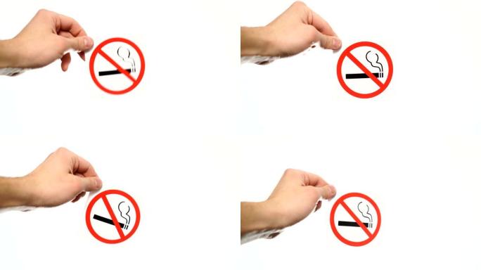 在白色上显示警告标志 “禁止吸烟” 的手