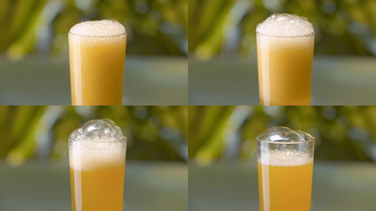 汽水橙色饮料倒入玻璃杯中