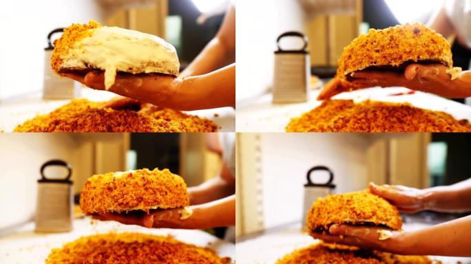 女人在面包店的特写镜头中覆盖了带有碎屑的奶油蛋糕