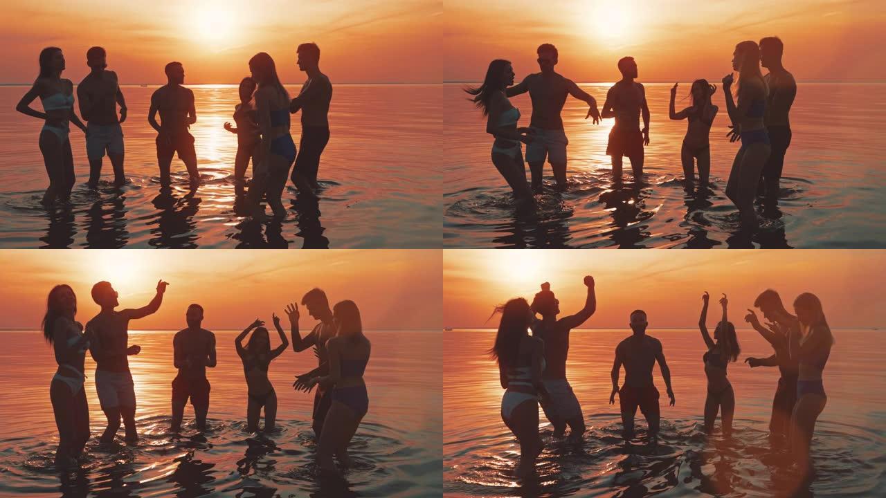 六个人在水面上对着夕阳起舞。慢动作