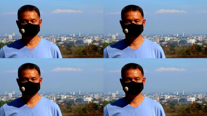 男子戴带城市景观的卫生口罩