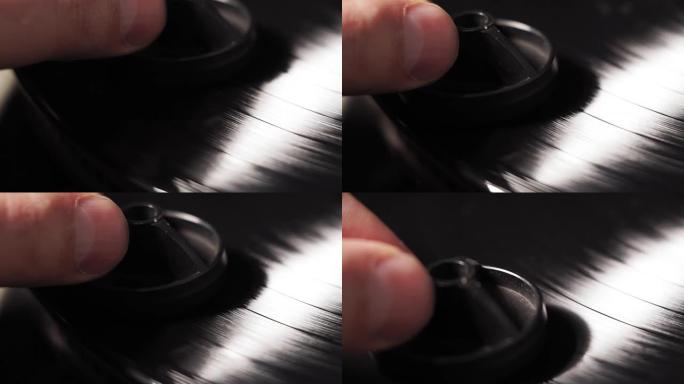 老式转盘的唱片正在旋转。清除记录中的灰尘。特写选择性聚焦