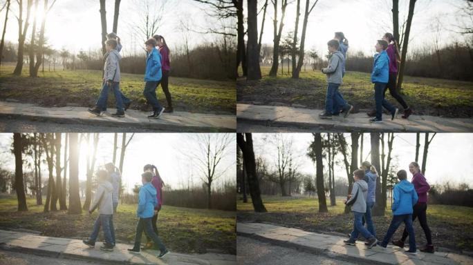 在公园散步的家庭外国人外国朋友走路散步