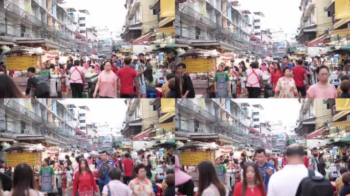 在泰国曼谷市的街头市场上行走的人群。