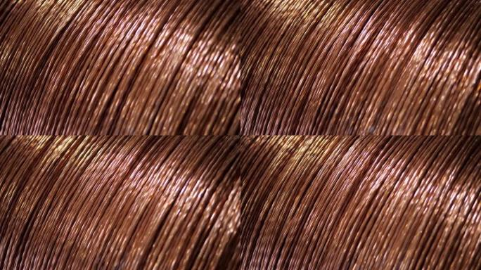 在工厂，近距离铜线缠绕在大线圈上，用于制造电缆。