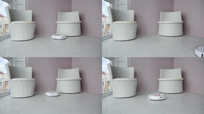 机器人真空吸尘器在现代公寓执行自动清洁。白色圆形自动真空技术机器在客厅家具周围行驶