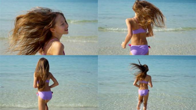 暑假期间海滩上可爱的小女孩。