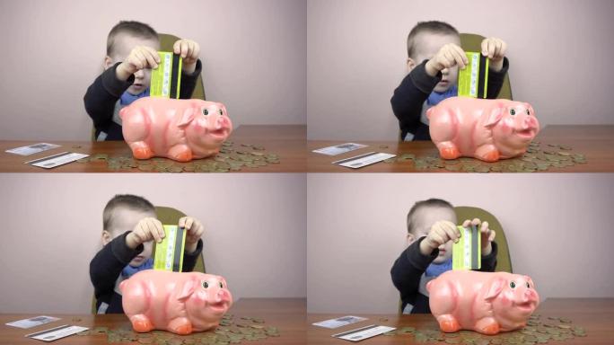小男孩试图在存钱罐里戳一张信用卡。