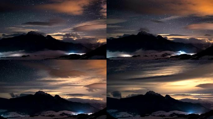 冬日山脉的星空和五颜六色的云彩全景，山谷时光流逝