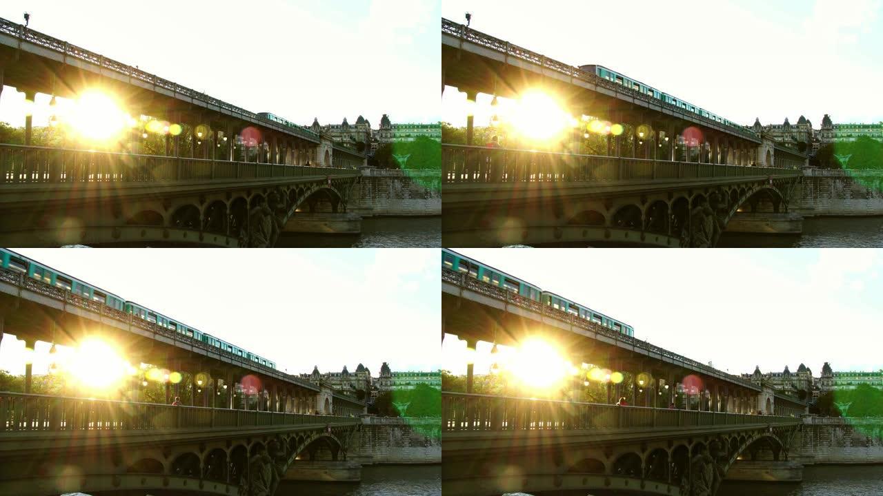 巴黎桥上的地铁列车。日落之光。