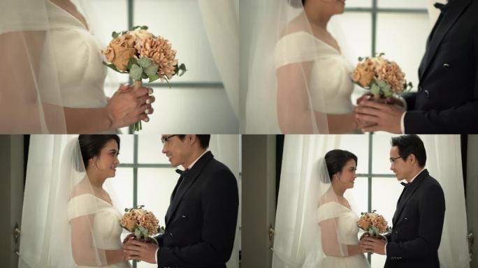 新郎和新娘在工作室为婚前礼服拍照。手持镜头，真实生活