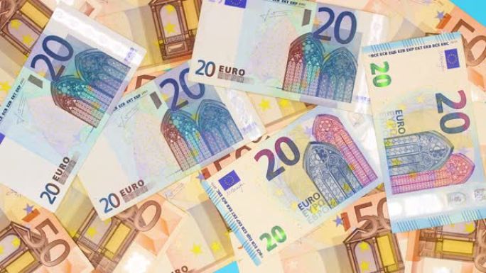 五十，二十，十和五欧元的钞票填充蓝色背景-停止运动