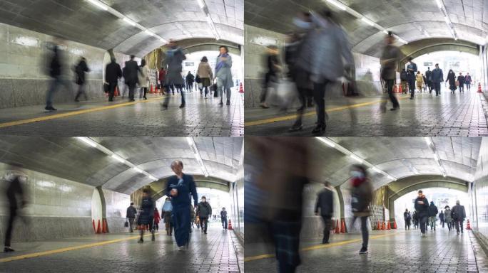 4k延时: 高峰时段，东京市中心火车站附近的隧道下行人人群的权利