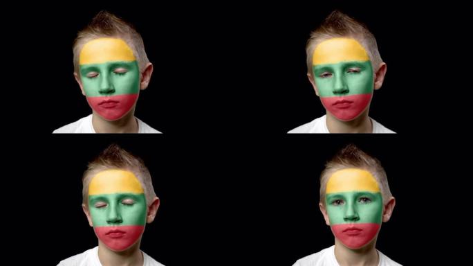立陶宛足球队的伤心球迷。脸上涂着民族色彩的孩子。