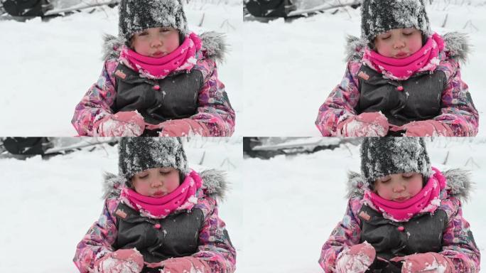 孙女肖像在雪山冬季运动中玩耍