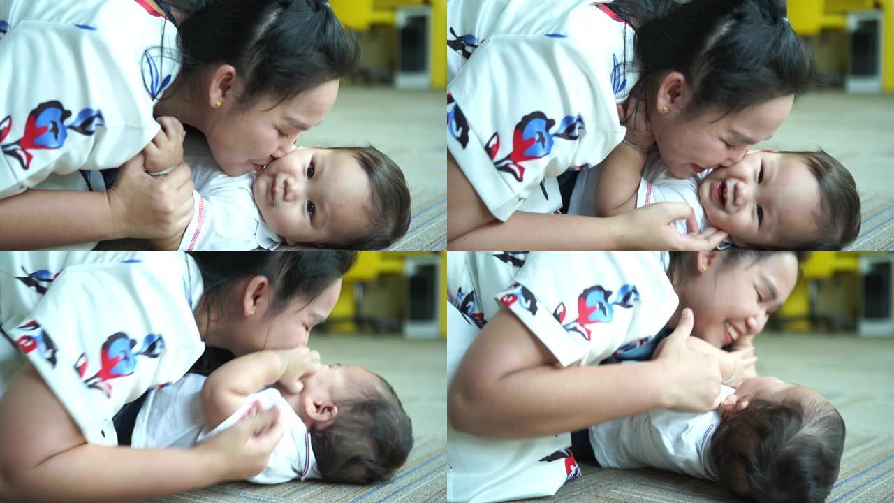 亚洲单身妈妈和她的男婴玩耍和接吻
