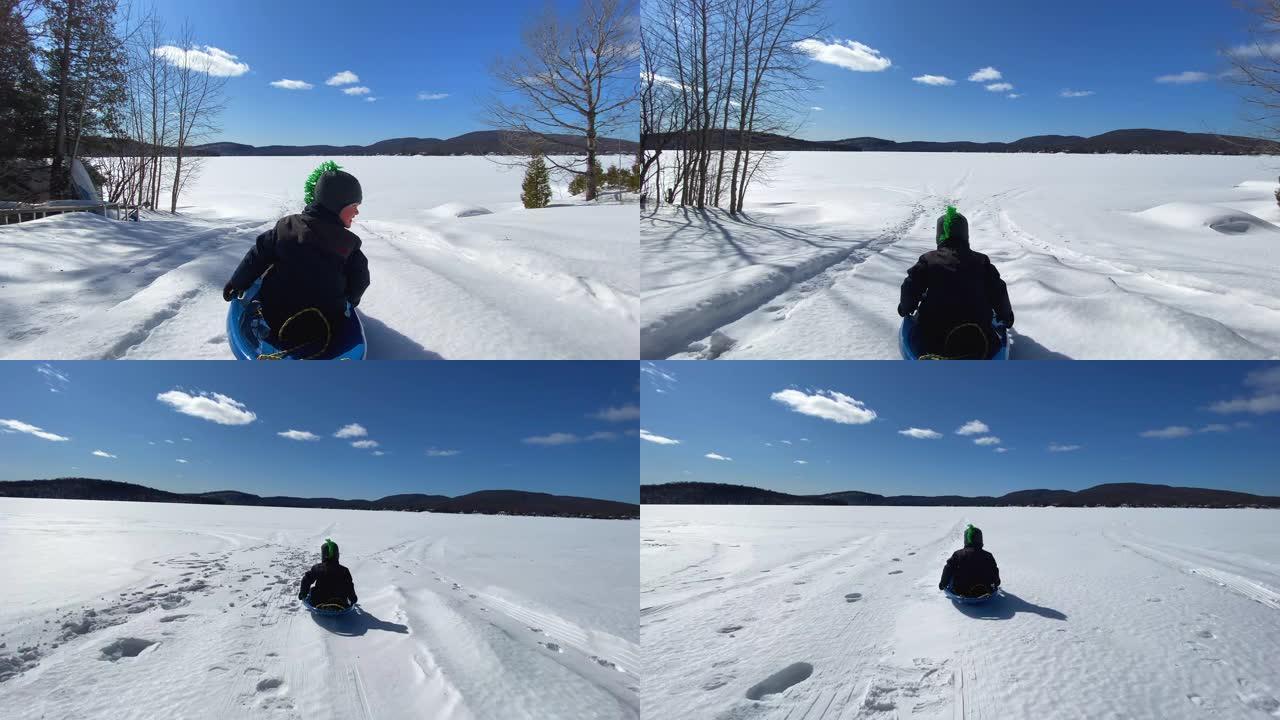 冬季儿童在户外滑行的4k视频视点