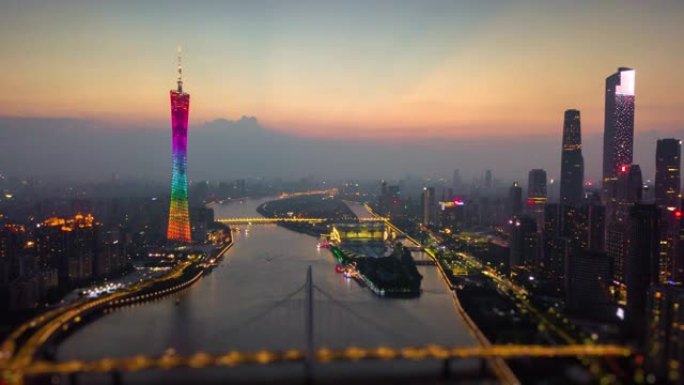 日落时间夜间照明广州市中心城市景观珠江猎德桥空中倾斜移动全景4k延时中国