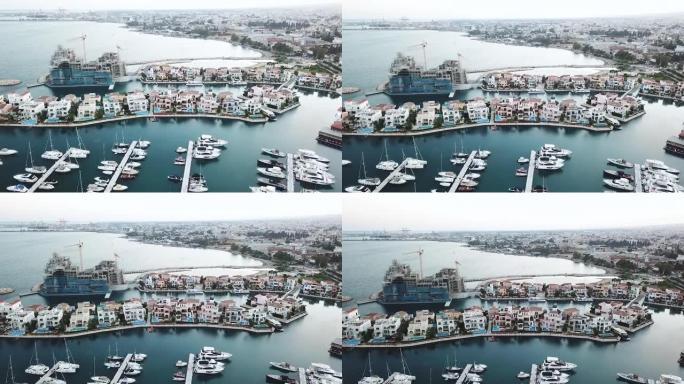 塞浦路斯新利马索尔码头的空中全景，新的豪华住宅和停泊的游艇