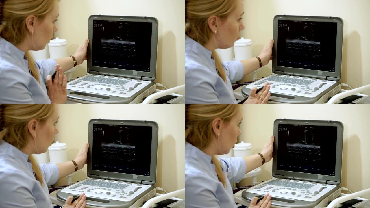 女医生用超声波设备检查病人的心脏。高清