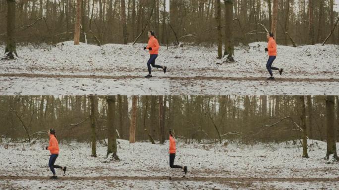 在公园跑步的女孩。侧面跟随女人在冬季森林慢跑的景色。适合专注的女运动员在休赛期为马拉松做准备。女人跑