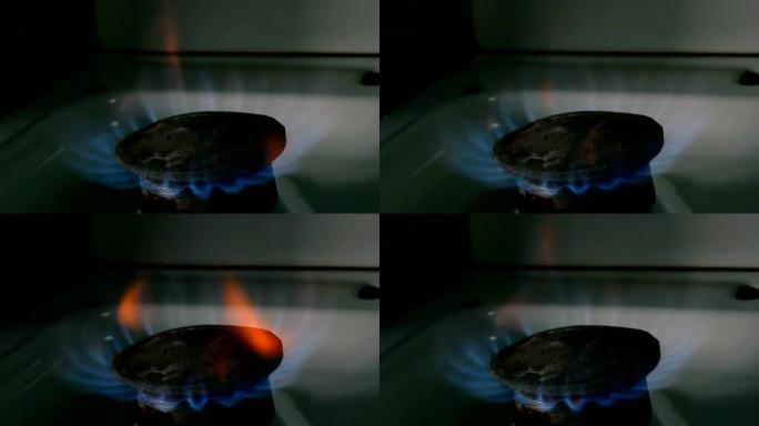 从旧燃烧器炉顶着火，在家用厨房用火焰丙烷气体或甲烷燃烧烹饪。