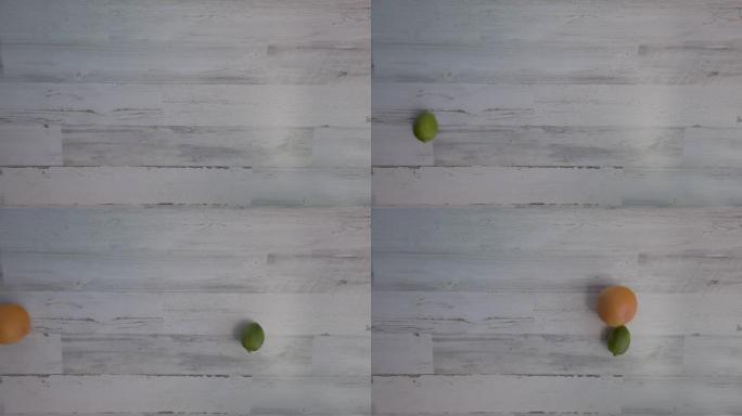 石灰和葡萄柚柑橘卷到白色木桌或地板上，平铺，4k。