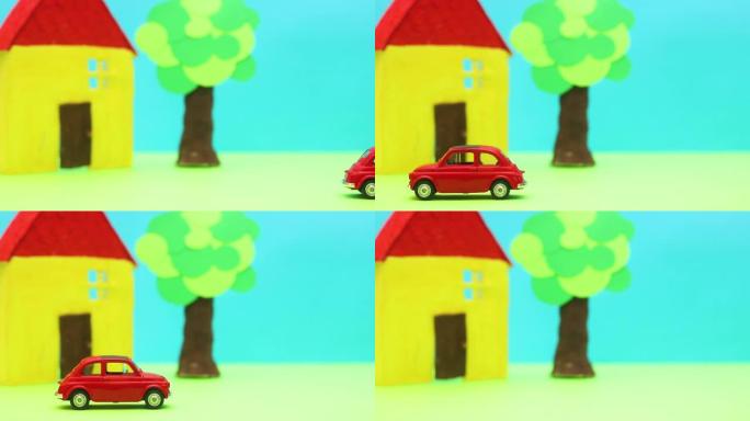小红色老爷车经过黄房子和树-停止运动