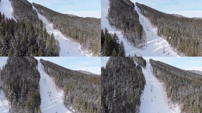滑雪者的鸟瞰图沿着滑雪场附近的滑雪场下坡。布科维尔