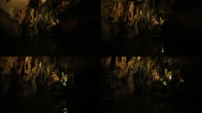 漂浮在充满钟乳石的令人毛骨悚然的黑暗洞穴中