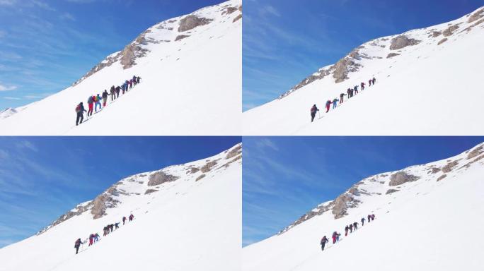 高山登山队在冬季高海拔山峰连续向上移动