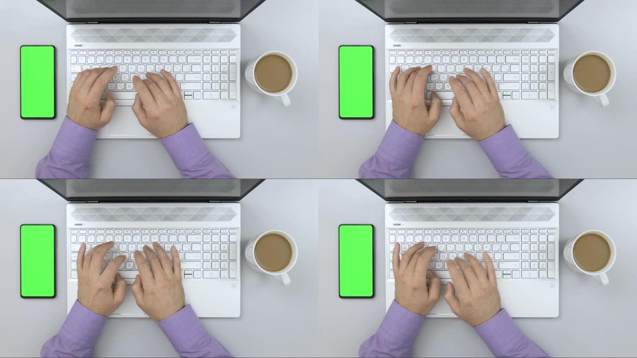 商人在桌子上的笔记本电脑上打字。绿屏智能手机。学生学习。顶视图工作台创意设计师。在台式计算机上工作的