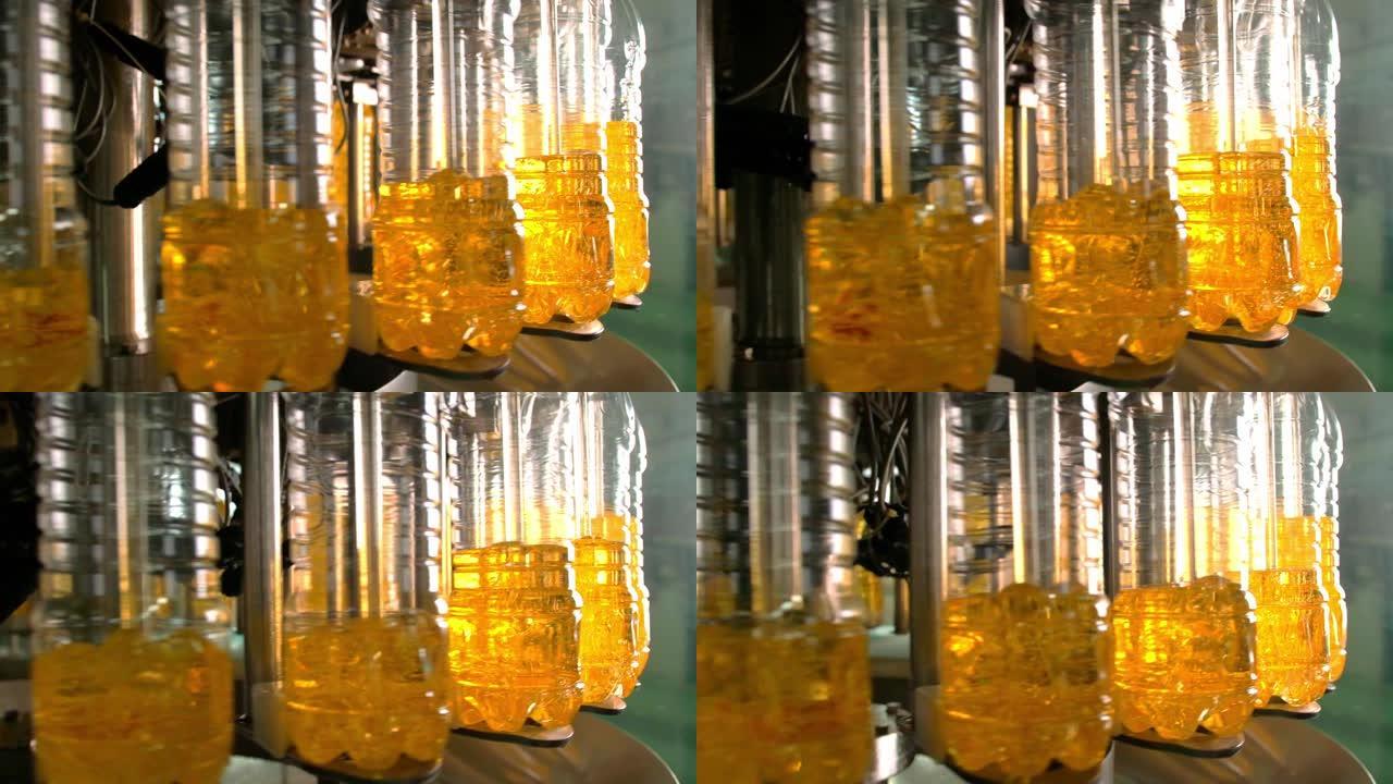 瓶子里的葵花籽油在生产线上移动。