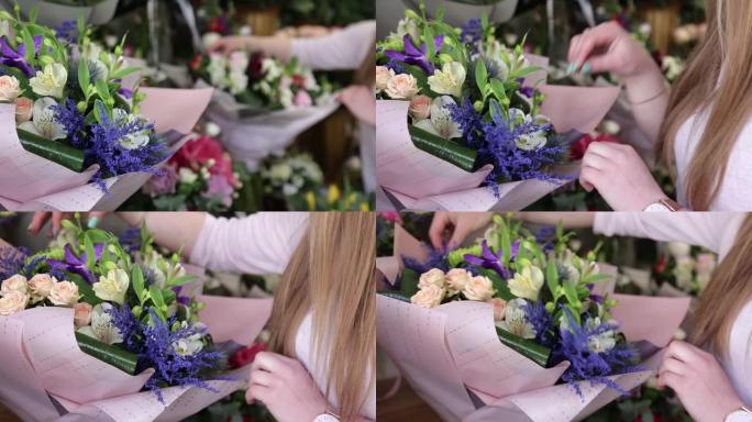 女花店在花店安排美丽的鲜花花束。