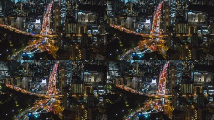 4k延时: 从文京市民中心摩天大楼平移东京城市景观minato主干道和天际线的左视图，以及晚上汽车和