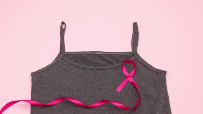 粉红丝带为国际癌症日穿上t恤-停止运动
