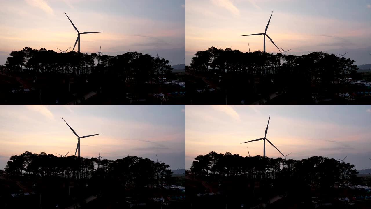 傍晚在农业山上旋转的风力发电机