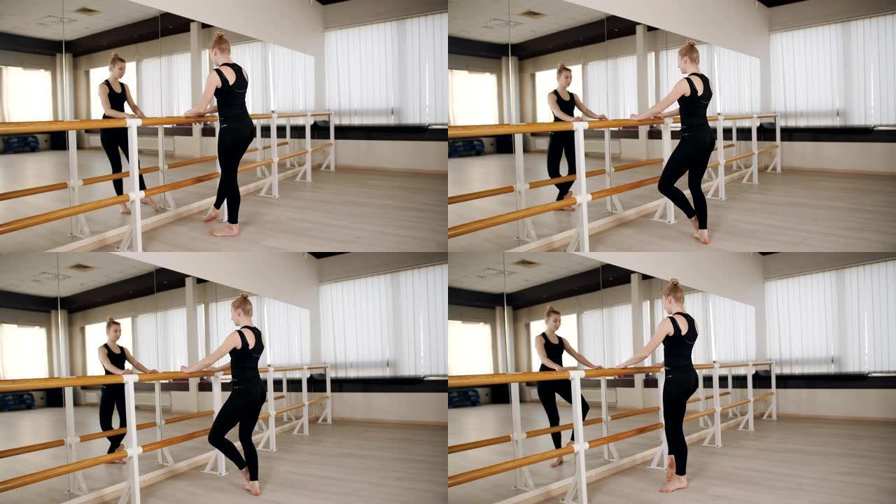 年轻优雅的女芭蕾舞演员在芭蕾舞课上锻炼服装