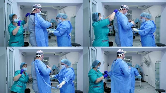 护士给整形外科医生穿手术服。