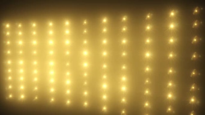 黄色闪烁VJ发光二极管灯闪烁舞台上的聚光灯墙。