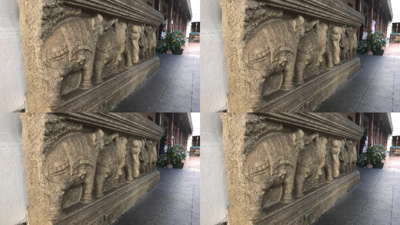 坎迪，斯里兰卡，2019年11月25日，斯里达拉达马利加瓦石像在寺庙的墙上