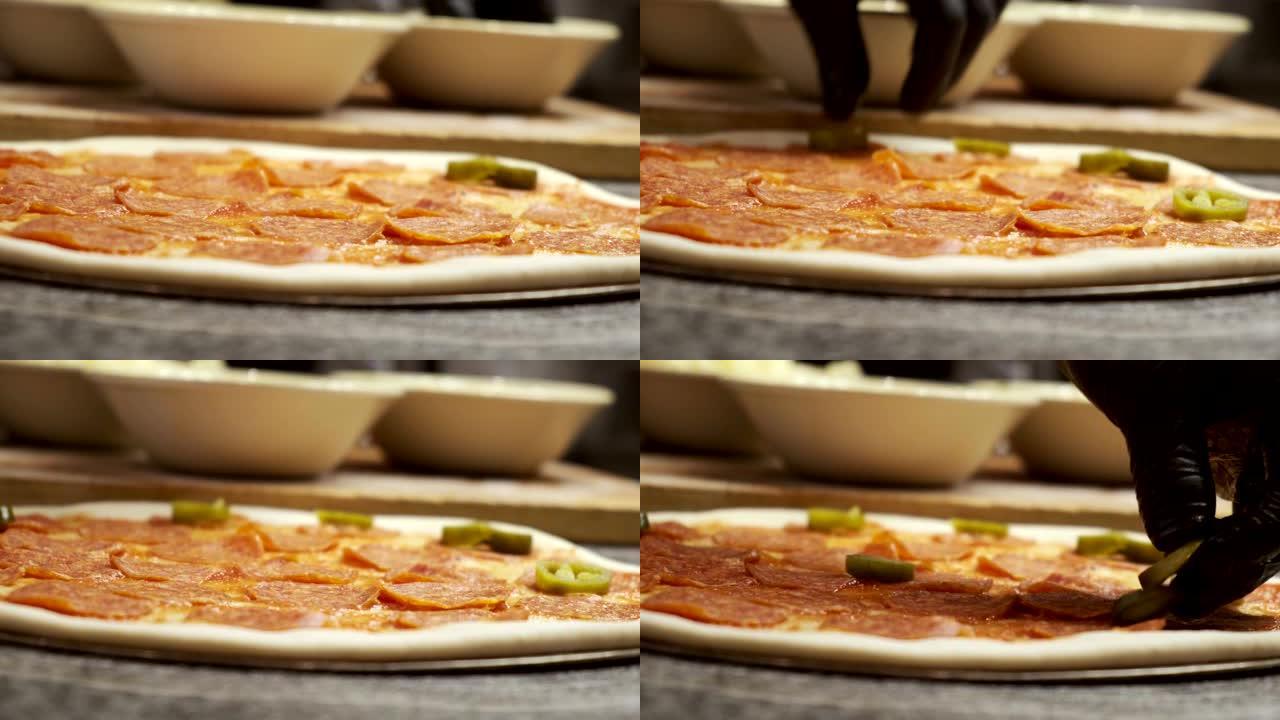 厨师在餐馆里做披萨。意大利辣香肠披萨食谱特写