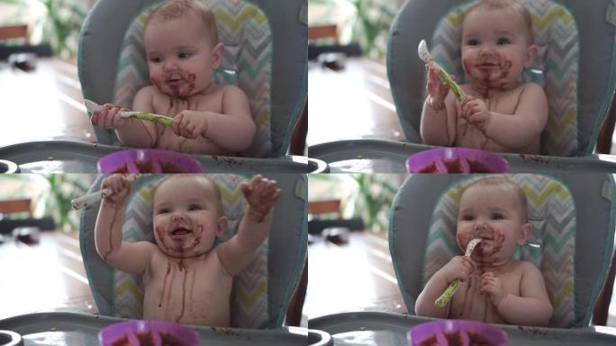 高脚椅上快乐的年轻女婴的肖像吃巧克力