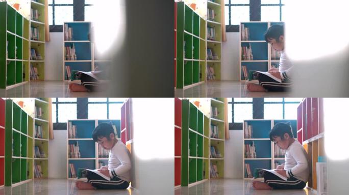 亚洲男孩在学校图书馆读书，教育理念。4k多莉射门。