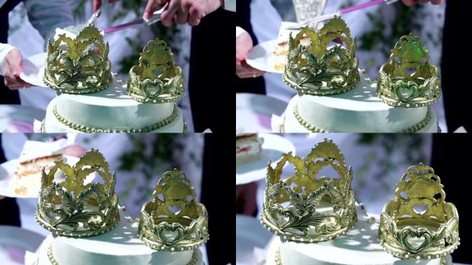 新婚夫妇与客人切割并分享结婚蛋糕