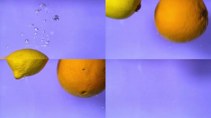 橙色和柠檬在慢动作的紫色背景下滴落并在水中旋转